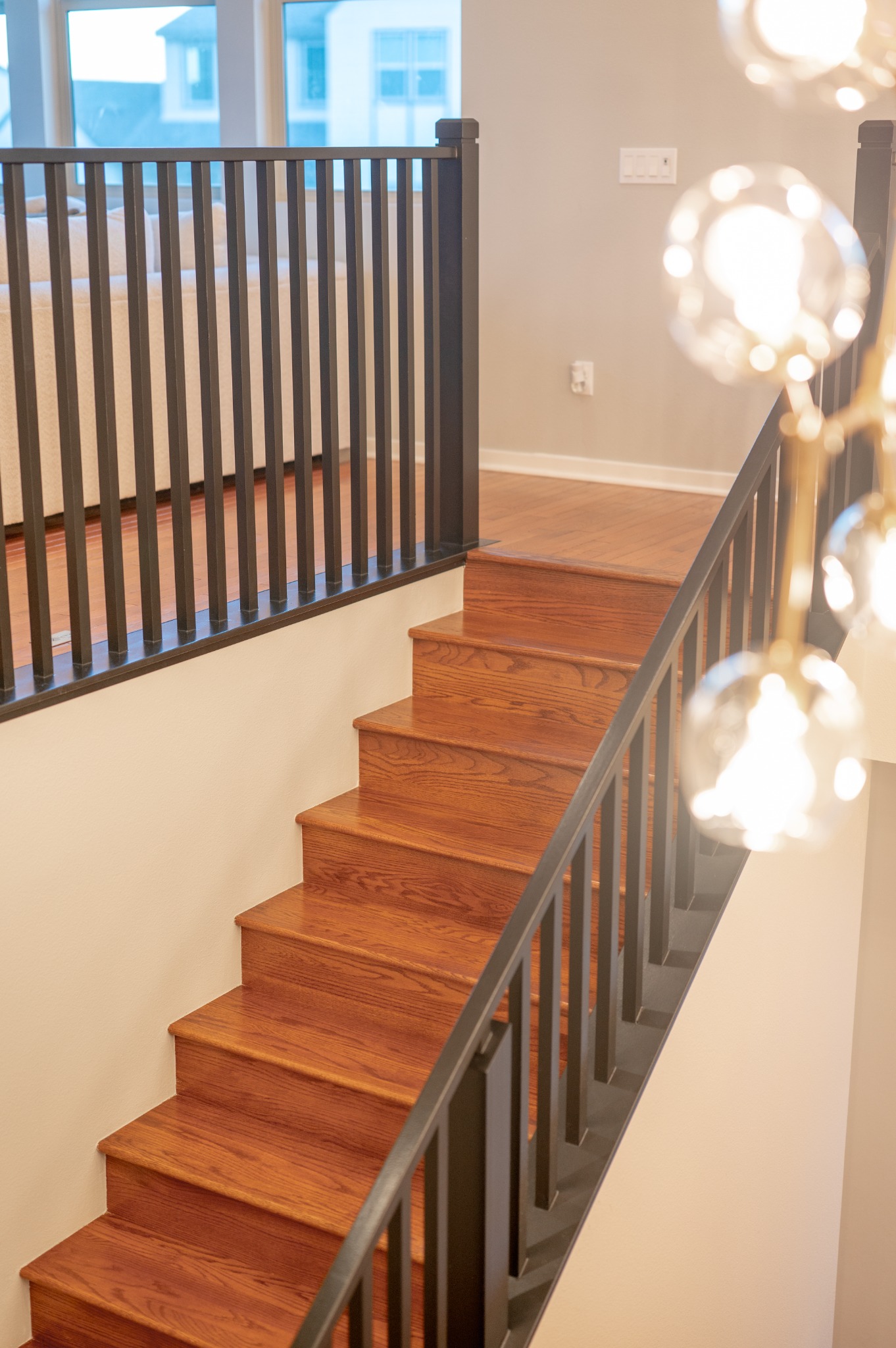 Staircase, railing and sculptural lighting detail